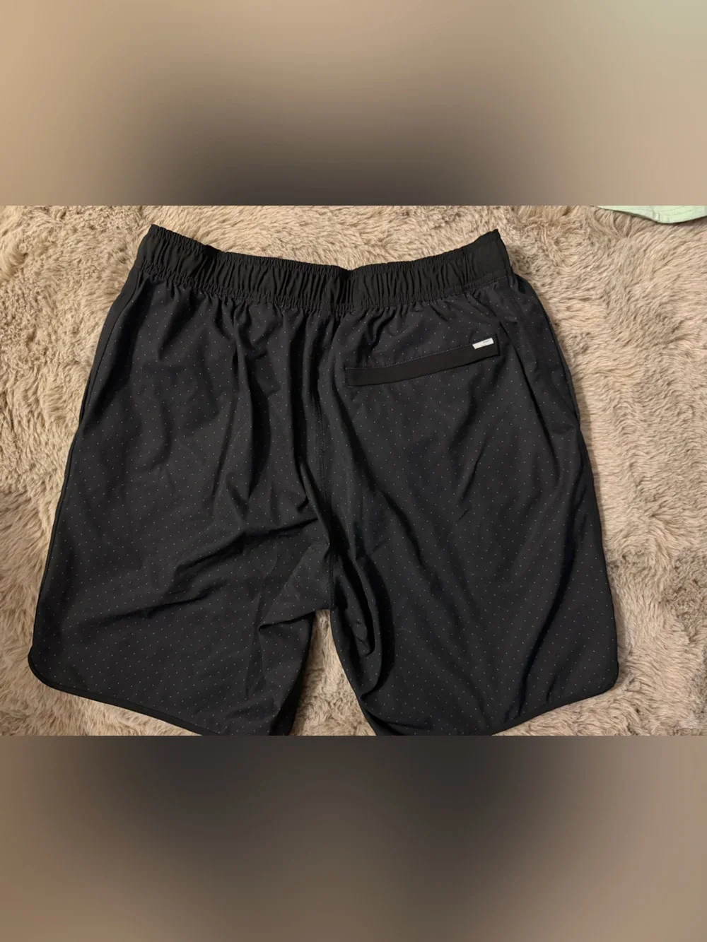 Vuori Black Athletic Shorts with Red Accent